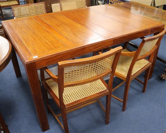 A Chinese hardwood extending dining table and six matching chairs, extends to 203 x 107cm